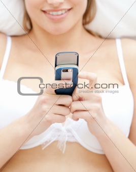 Close-up of a woman in underwear sending a text