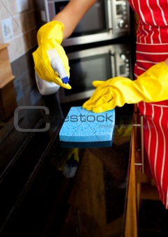 Close-up of a woman doing housework