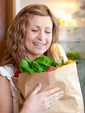 Charming woman holding a grocery bag