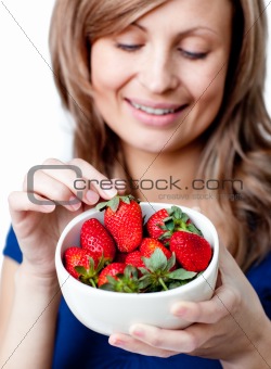Caucasian woman eating strawberries 