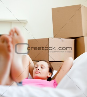 Attractive woman having a break between boxes