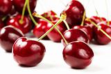 two cherries in front of many