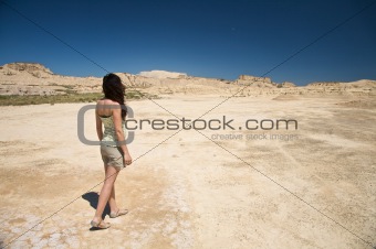 sensual woman walking at the desert