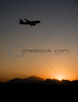 Silhouette of an aircraft landing