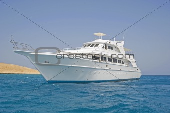 Large motor yacht out at sea