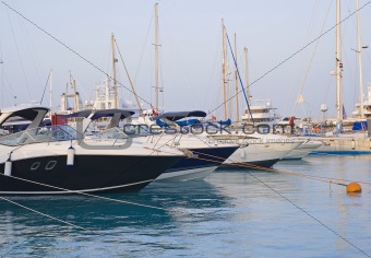 Motor yachts moored in a marina