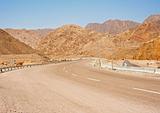 Winding road through desert mountains