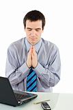 Praying businessman