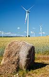 hay bale with wind turbines