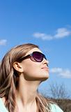 Relaxed blond woman with sunglasses outdoors