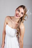 Attractive Young Woman in a White Dress