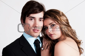 Well Dressed Young Couple Embracing