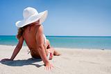 Young woman enjoying the sun on a beach