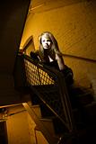Girl in stairwell.