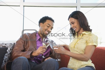 Couple toasting glasses.