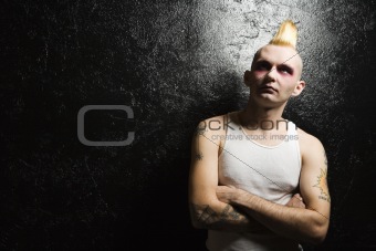 Punk with crossed arms.