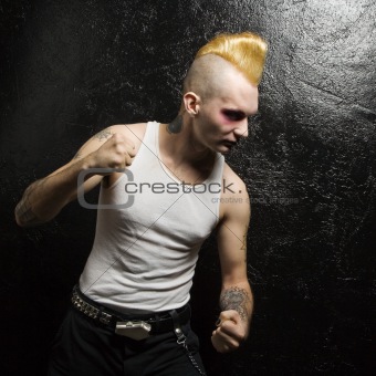 Punk with clenched fists.