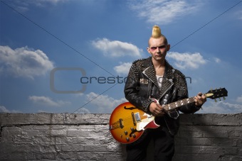 Punk holding guitar.