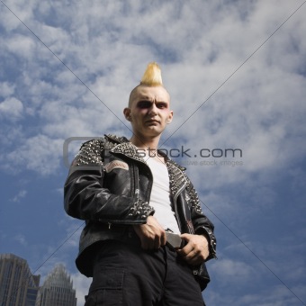Portrait of a punk outside.