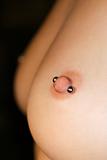 Female breasts with piercing..