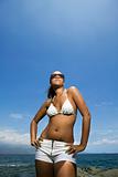 Woman on beach in bikini.