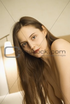 Nude woman with long hair.