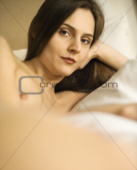 Nude woman relaxing.
