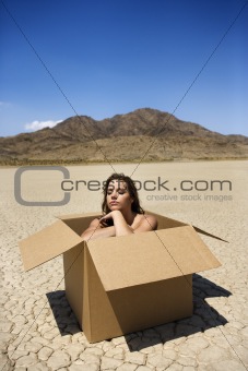 Nude woman in desert.