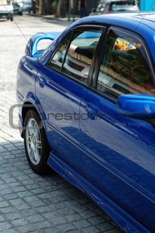 Rear view of blue sportive car
