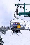 Skiers on chairlift