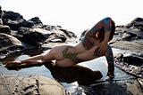 Sexy nude tattooed woman.
