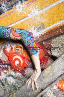 Tattooed woman's arm.