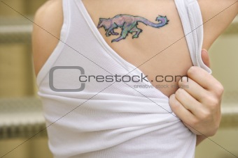 Young woman with tattoo.