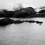 Waves crashing on rocky shore.