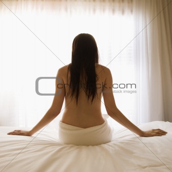 Woman on bed.