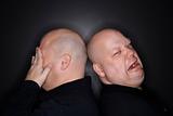 Bald twin men crying.