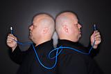 Twin men holding cable.