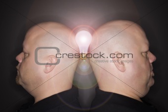 Twin men profile with lightbulb.