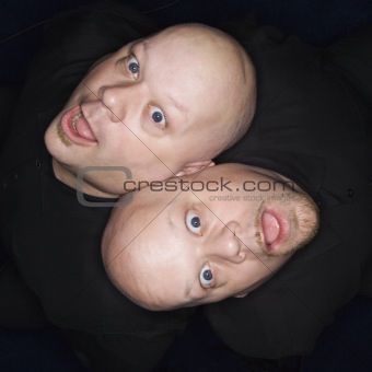 Twin bald men. 