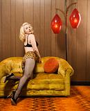 Woman posing on retro couch.