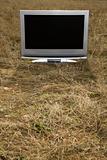 Television in grass.