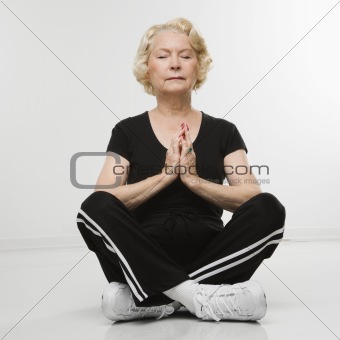 Senior woman meditating.