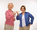 Two women toasting wine.