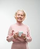 Woman holding coffee cup.