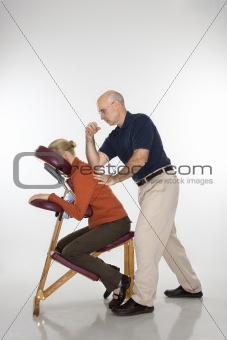Man massaging woman.