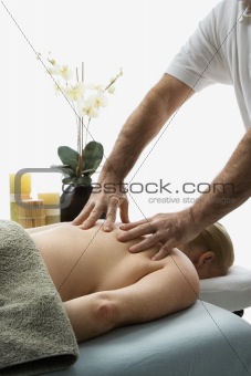 Man massaging woman.
