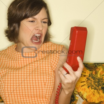 Woman screaming at phone.