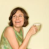 Woman smiling with cup.