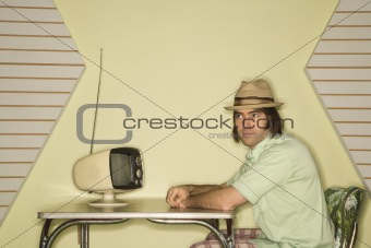Man sitting at table.