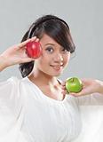 young pretty girl is holding an apples